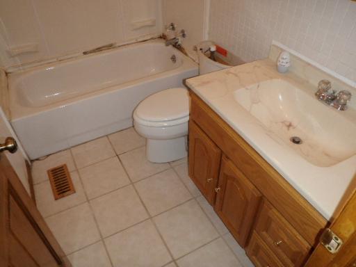 32 Marnel Road Montgomery, IL 60538 - Photo 12 of 12 a bathroom with a sink a toilet and bathtub
