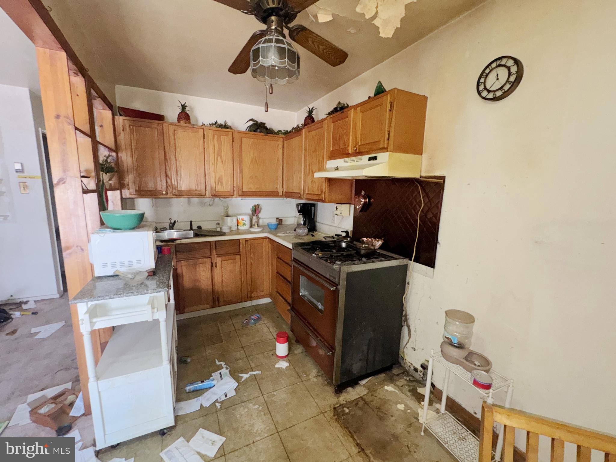 914 Burnside Road Sharon Hill, PA 19079 - Photo 8 of 13 a kitchen with granite countertop a sink a counter top space appliances and cabinets