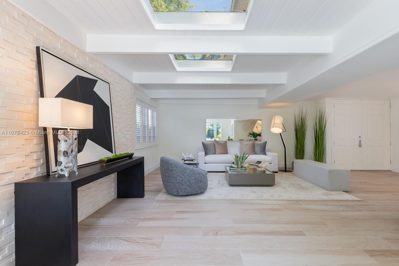 1812 Fairhaven Place Miami, FL 33133 - Photo 12 of 37 a living room with furniture and a potted plant