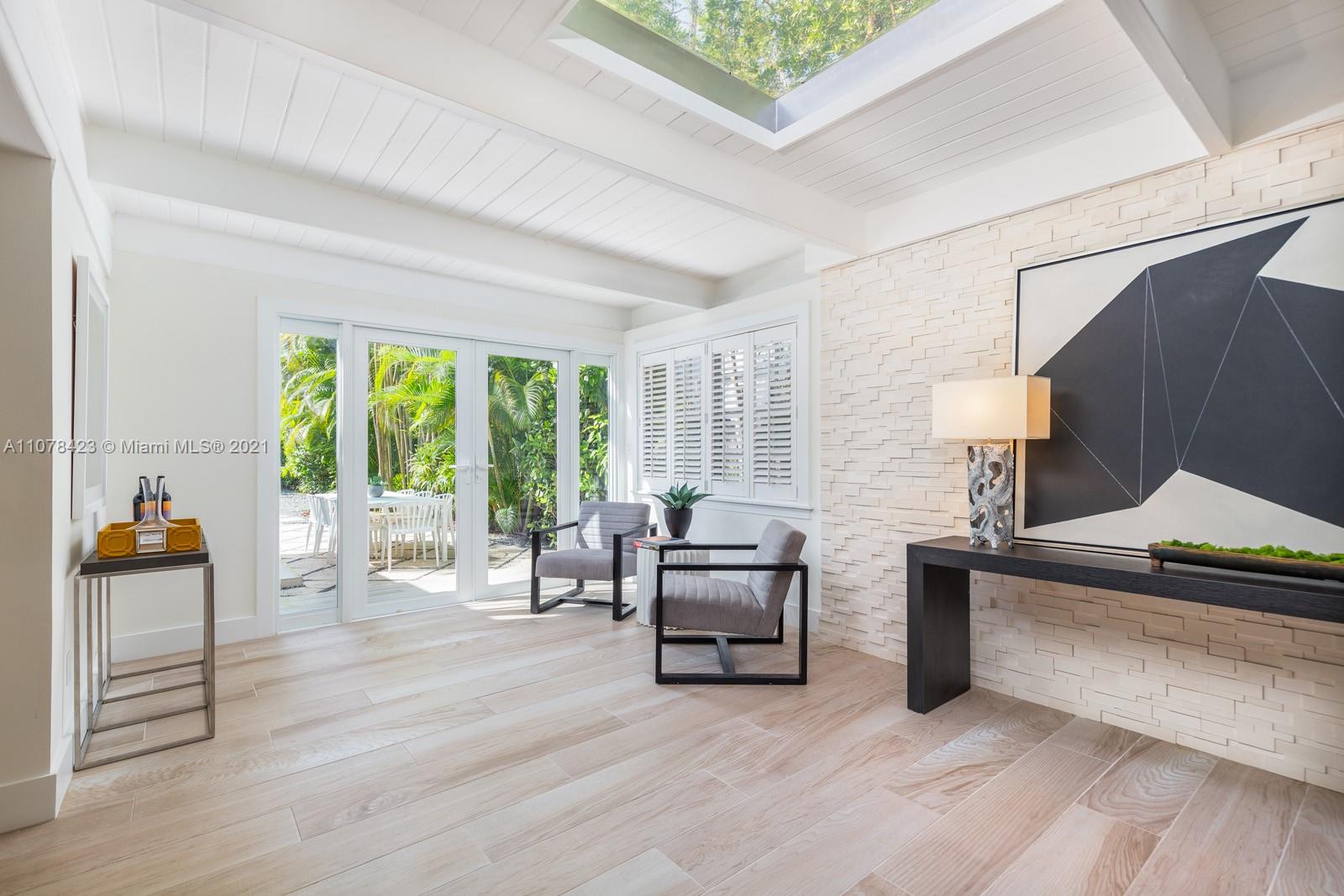 1812 Fairhaven Place Miami, FL 33133 - Photo 14 of 37 a living room with furniture and a lamp