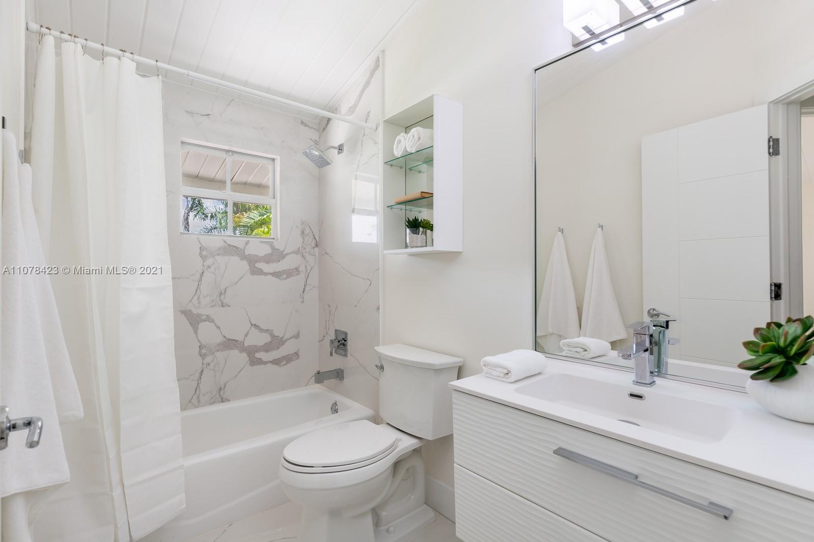 1812 Fairhaven Place Miami, FL 33133 - Photo 22 of 37 a bathroom with a sink toilet and shower