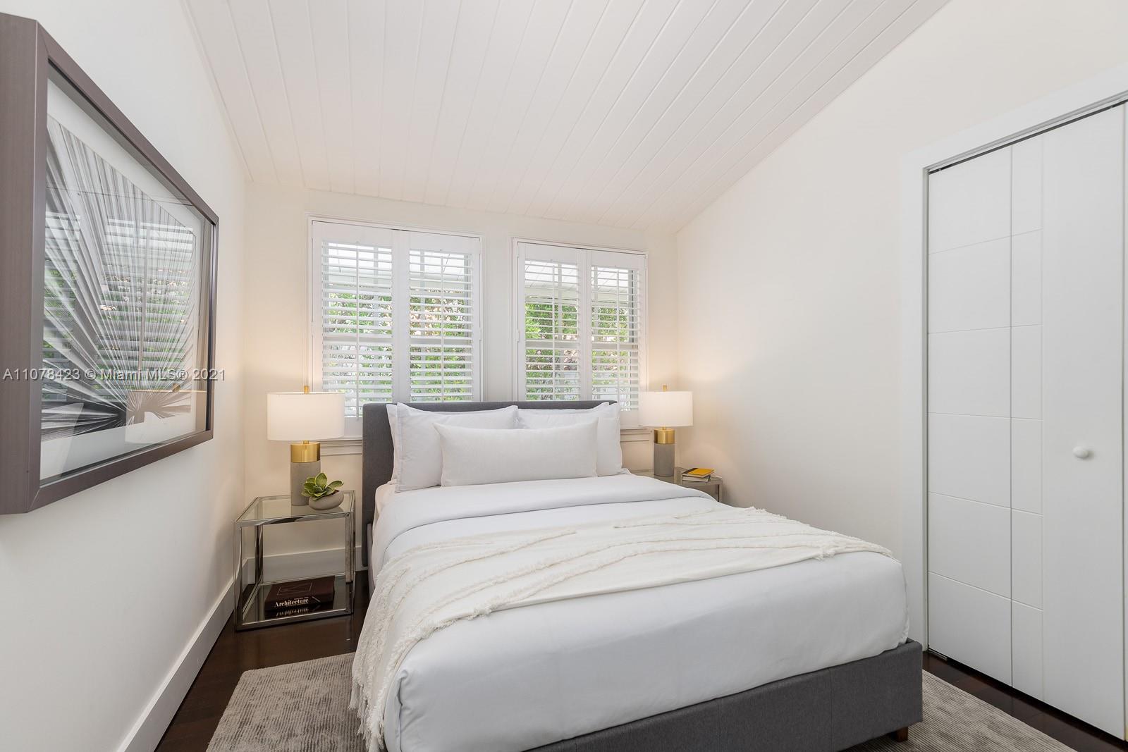 1812 Fairhaven Place Miami, FL 33133 - Photo 23 of 37 a bedroom with a bed and a window