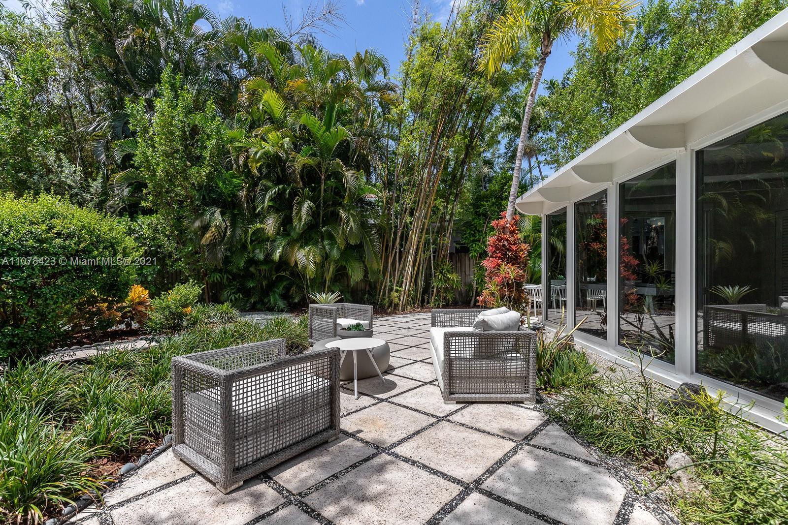1812 Fairhaven Place Miami, FL 33133 - Photo 25 of 37 a view of backyard with outdoor seating and green space