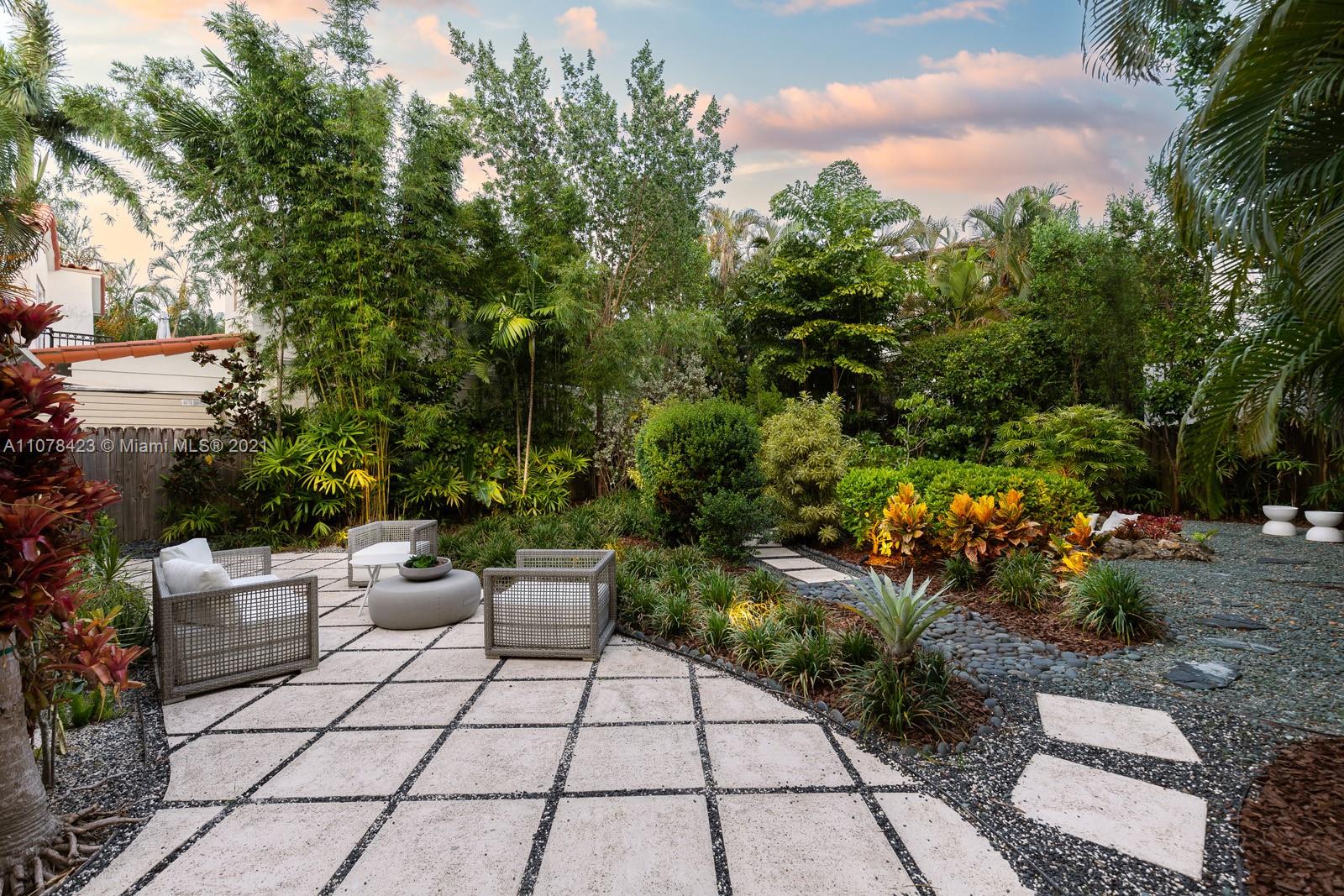 1812 Fairhaven Place Miami, FL 33133 - Photo 27 of 37 a view of backyard with plants and outdoor seating