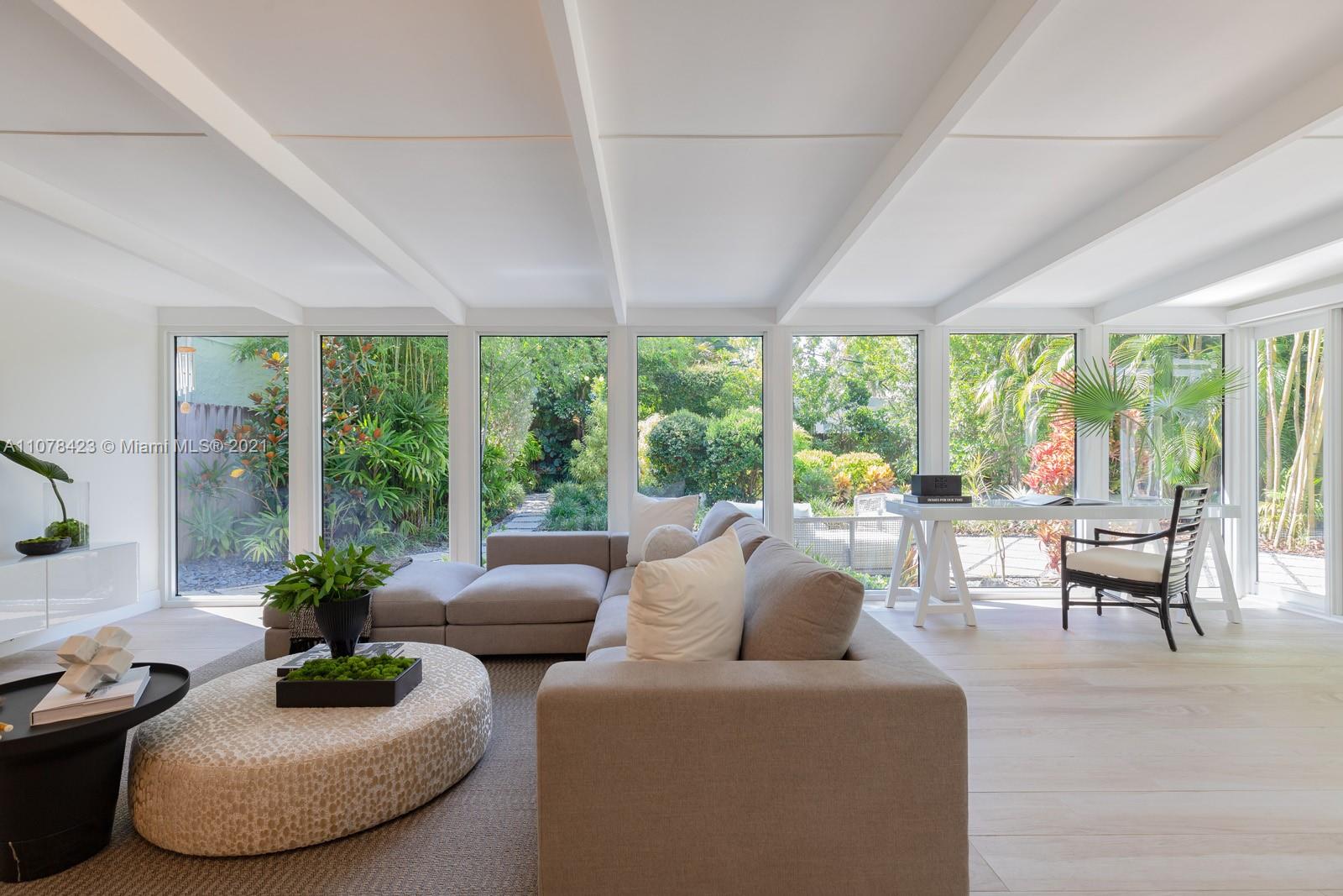 1812 Fairhaven Place Miami, FL 33133 - Photo 3 of 37 a living room with furniture and a large window
