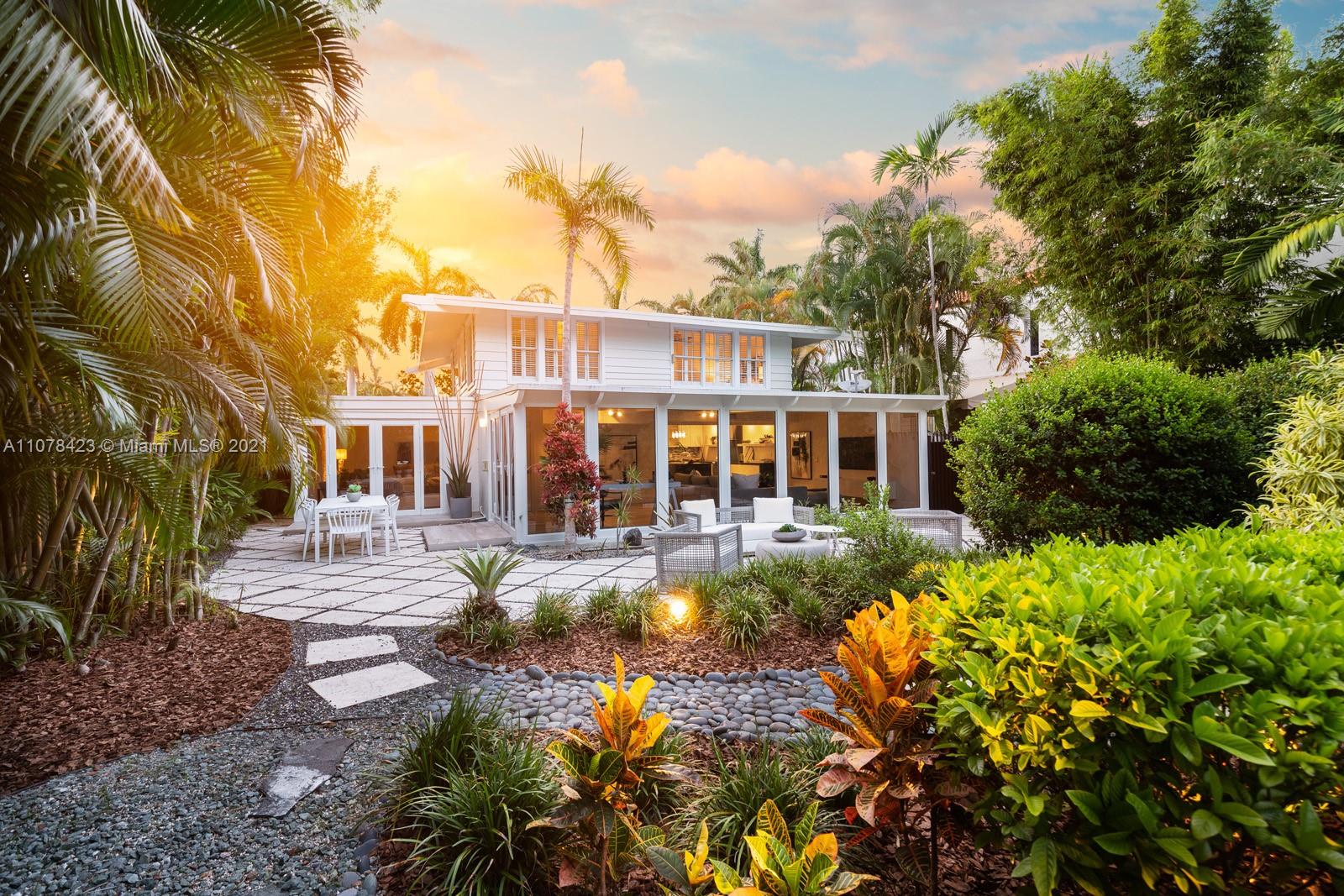 1812 Fairhaven Place Miami, FL 33133 - Photo 32 of 37 a view of a house with a yard