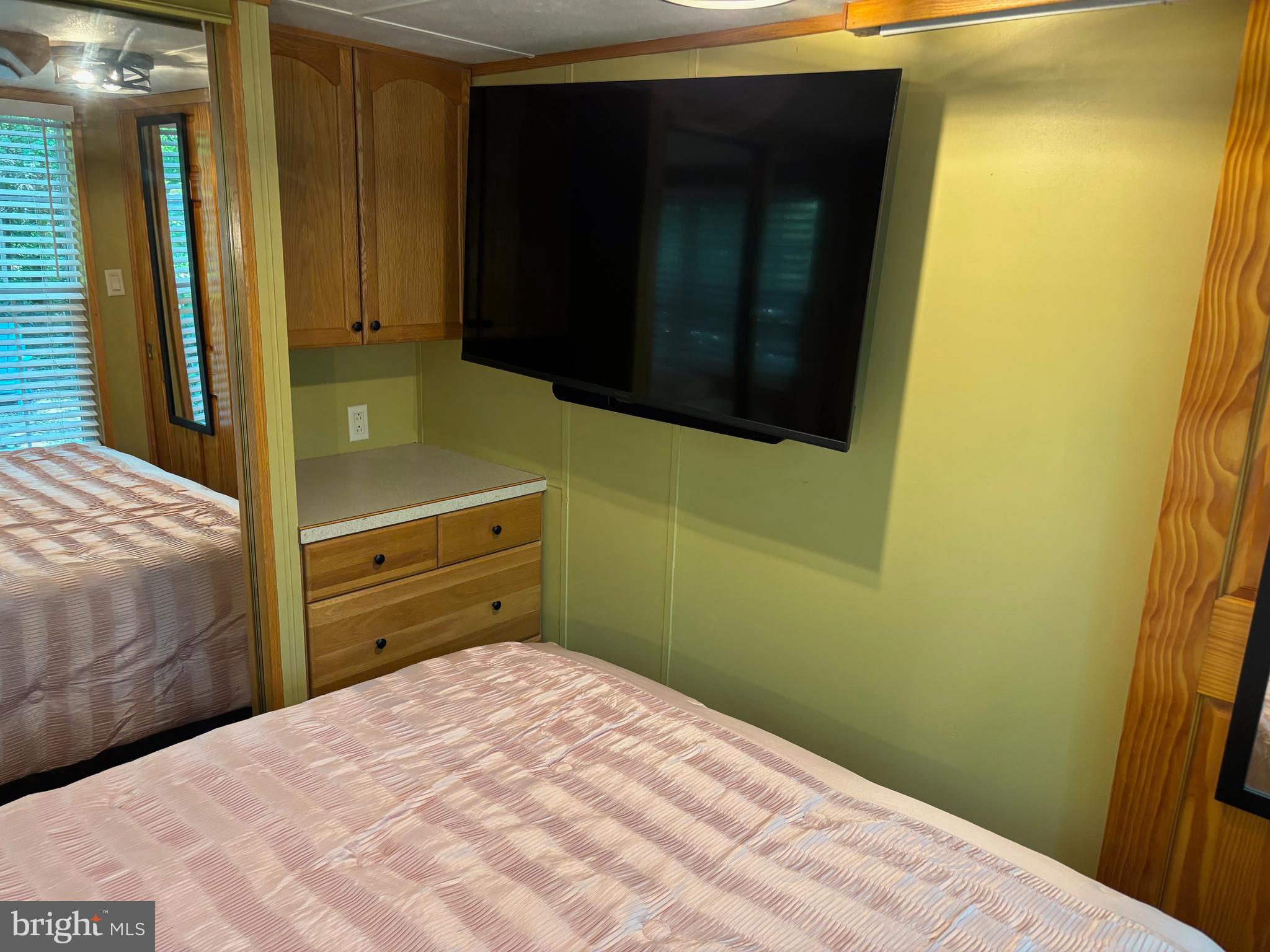 724 Monmouth Road, Unit 14 Cream Ridge, NJ 08514 - Photo 6 of 25 a bedroom with a bed and a dresser