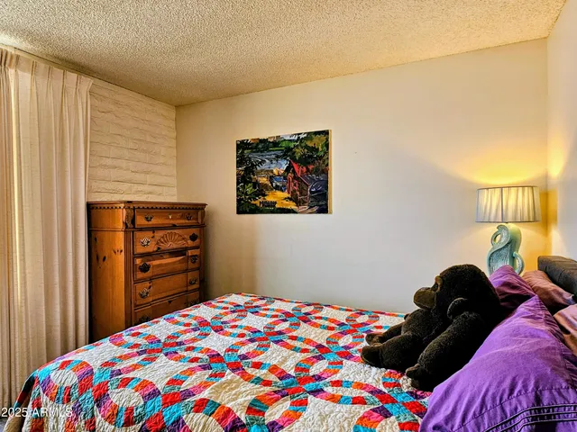 a bedroom with a bed and a closet