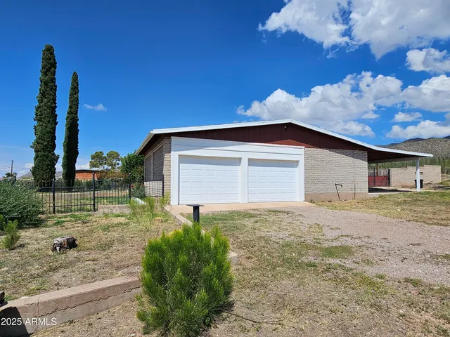 a house view with a garden space