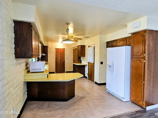 a view of a living room and kitchen