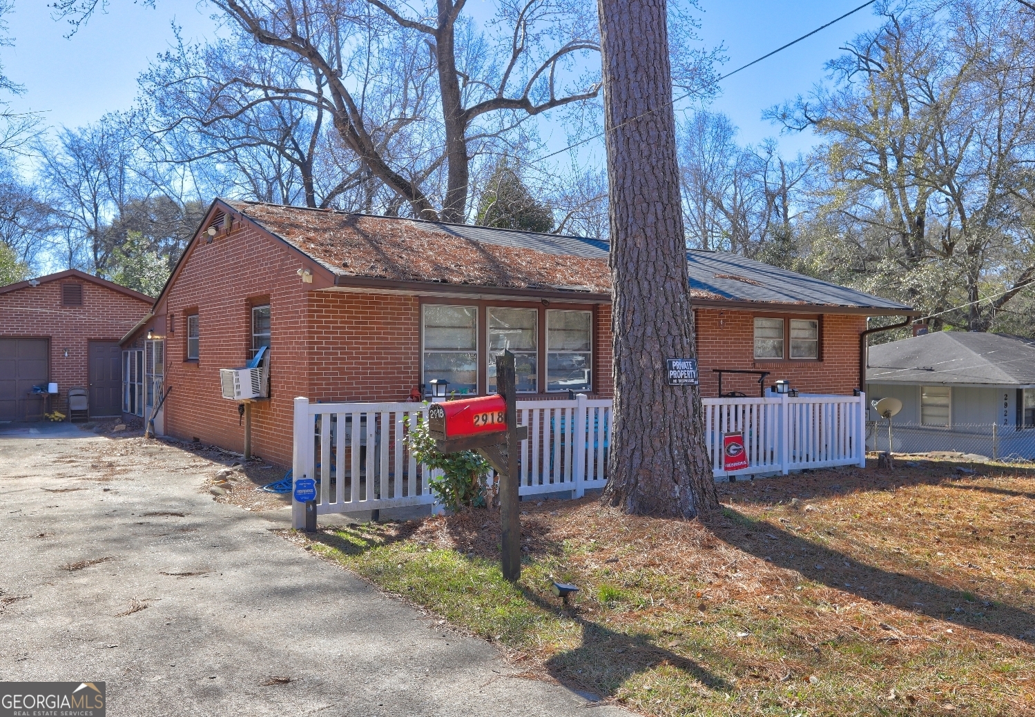 2918 Emerson Circle Macon, GA 31206 - Photo 2 of 8 a view of a house with a yard covered in snow