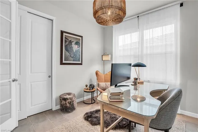 a dining room with a table and chairs