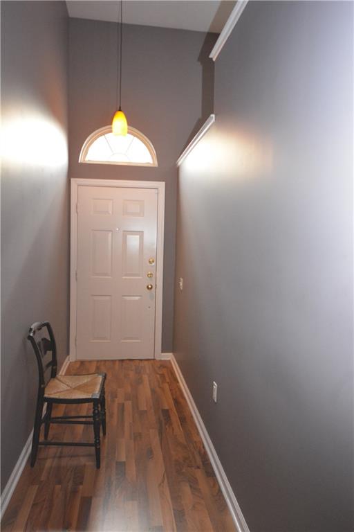 218 Grace Street McKees Rocks, PA 15136 - Photo 2 of 22 Freshly painted entry with laminate flooring and palladium window.