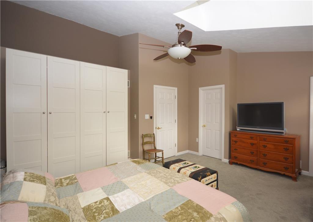 218 Grace Street McKees Rocks, PA 15136 - Photo 15 of 22 Master bedroom features walk-in closet and white cabinets stay with the home.