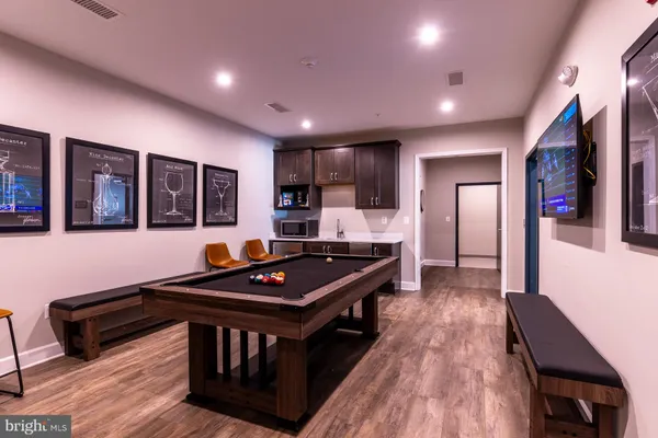 a kitchen with stainless steel appliances granite countertop a stove and a refrigerator