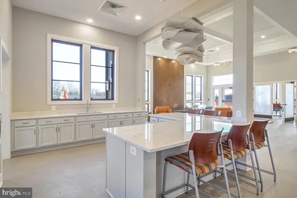 a view of a dining room with furniture and window