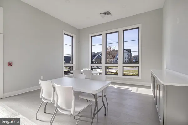 a kitchen with stainless steel appliances granite countertop a refrigerator sink and cabinets