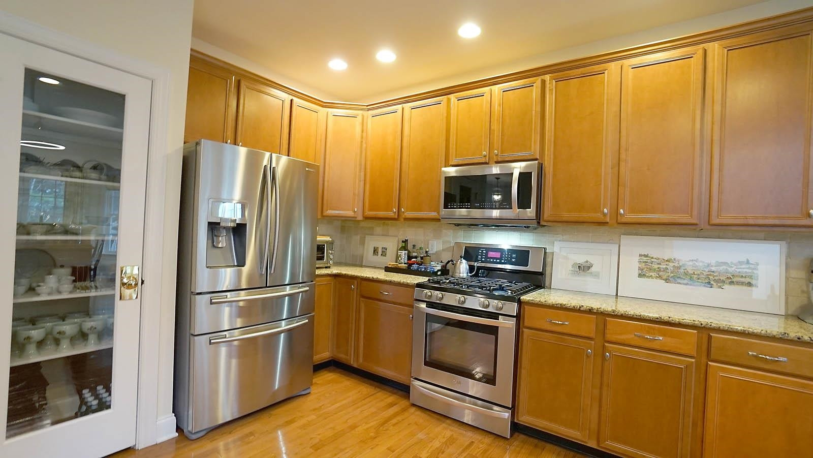 10217 Sporting Club Drive Raleigh, NC 27617 - Photo 12 of 45 Kitchen has 2 pantries and the refrigerator conveys. (note that the fridge in the panty does not convey) Kitchen
