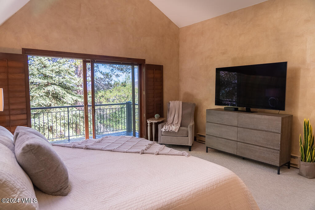 850 Eagle Drive Eagle-Vail, CO 81620 - Photo 12 of 32 a bedroom with a bed and flat screen tv