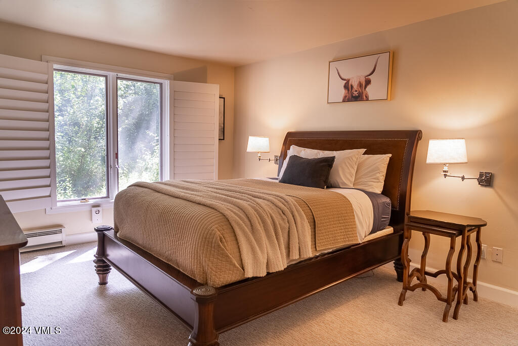 850 Eagle Drive Eagle-Vail, CO 81620 - Photo 18 of 32 a bedroom with a bed and chair