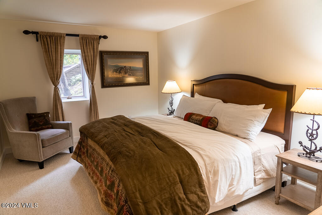 850 Eagle Drive Eagle-Vail, CO 81620 - Photo 19 of 32 a bedroom with a bed and a couch