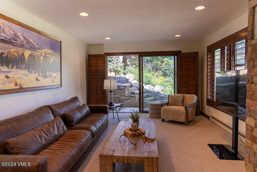 850 Eagle Drive Eagle-Vail, CO 81620 - Photo 4 of 32 a living room with furniture and a flat screen tv