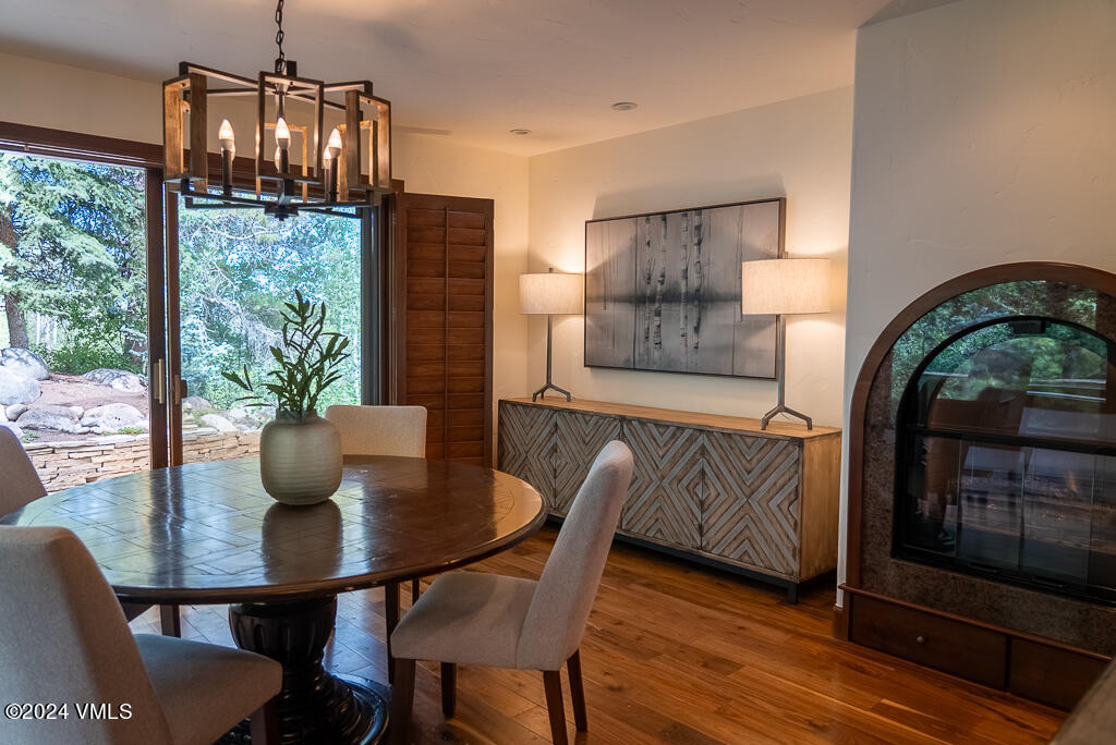 850 Eagle Drive Eagle-Vail, CO 81620 - Photo 9 of 32 a view of a dining room with furniture window and wooden floor