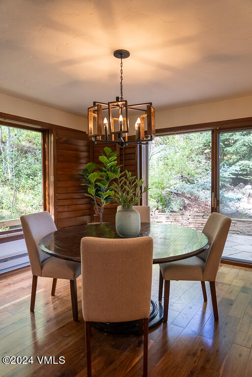 850 Eagle Drive Eagle-Vail, CO 81620 - Photo 10 of 32 a view of a dining room with furniture window and wooden floor