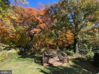 6909 Quander Road Alexandria, VA 22307 - Photo 35 of 36 DECK AND FALL FOLIAGE AS SEEN FROM BACK OF HOUSE