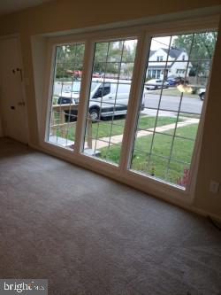 6909 Quander Road Alexandria, VA 22307 - Photo 9 of 36 BRIGHT LIVING ROOM WINDOWS