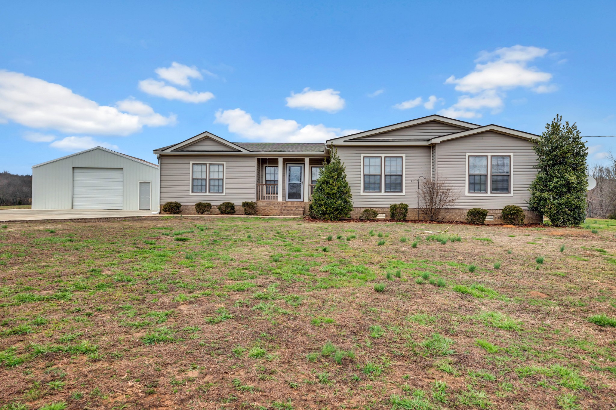 911 Poplar Hill Road Prospect, TN 38477 - Photo 1 of 33 a front view of house with yard and trees around