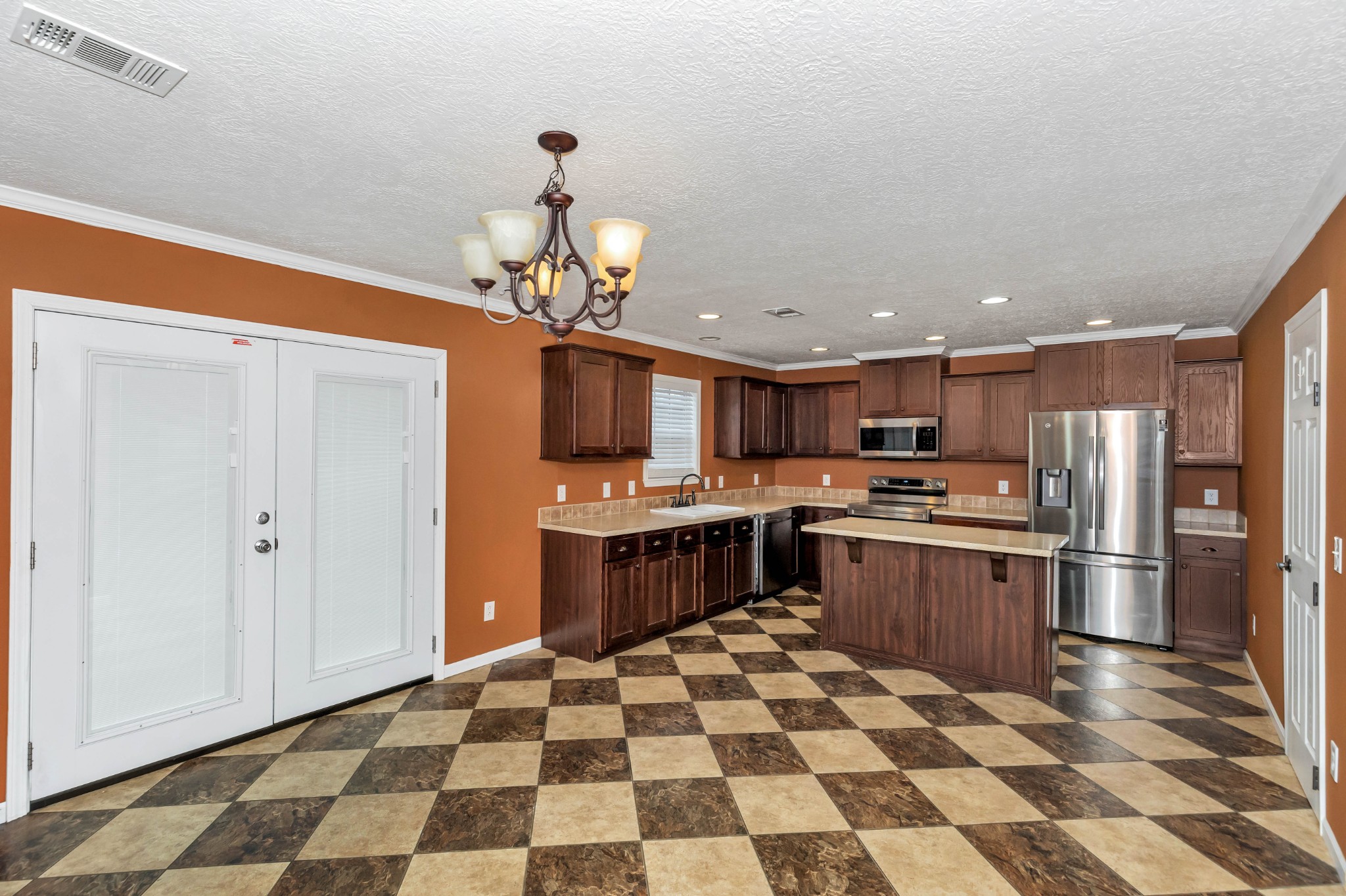911 Poplar Hill Road Prospect, TN 38477 - Photo 11 of 33 a kitchen with stainless steel appliances granite countertop a sink and cabinets