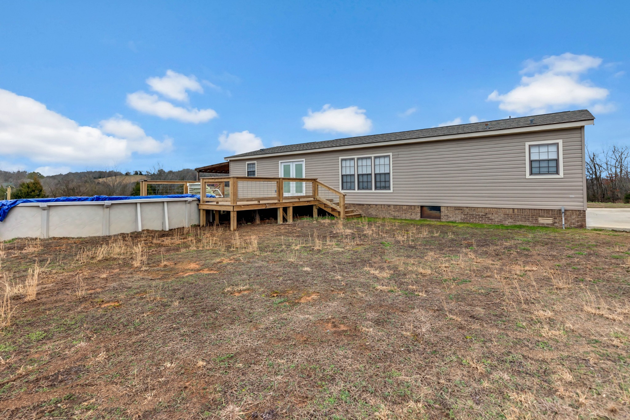 911 Poplar Hill Road Prospect, TN 38477 - Photo 22 of 33 a view of a house with pool and a yard