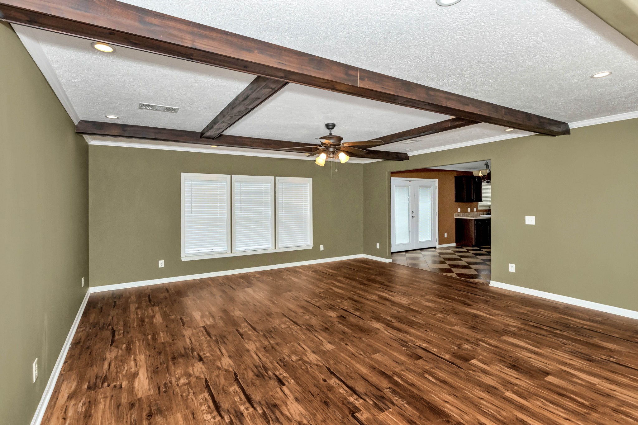 911 Poplar Hill Road Prospect, TN 38477 - Photo 4 of 33 a view of an empty room with wooden floor and a window