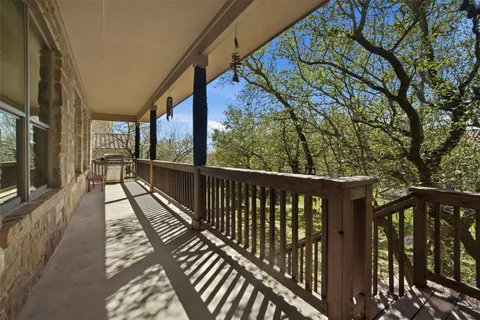 a view of a balcony with wooden floor