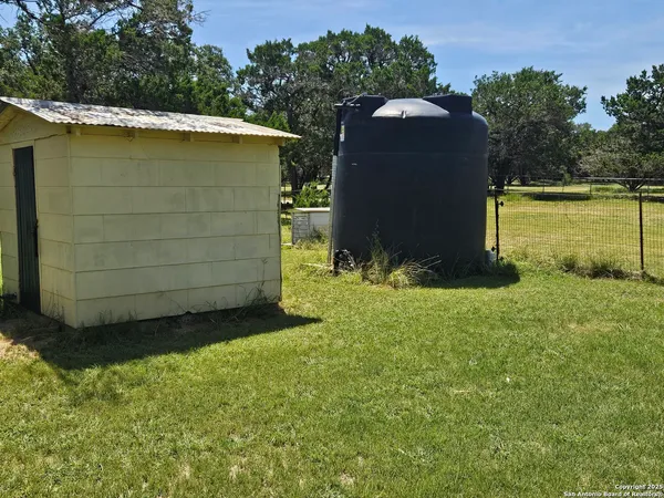 a view of a back yard of the house