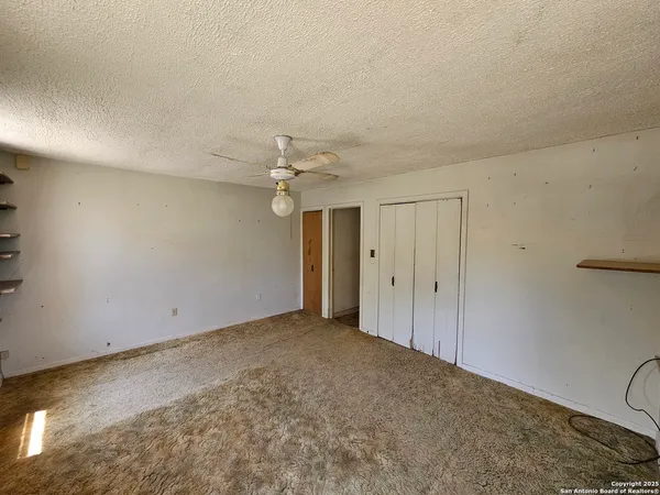 an empty room with a bathroom