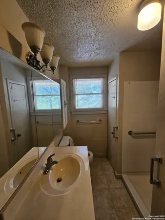 a bathroom with a sink and mirror