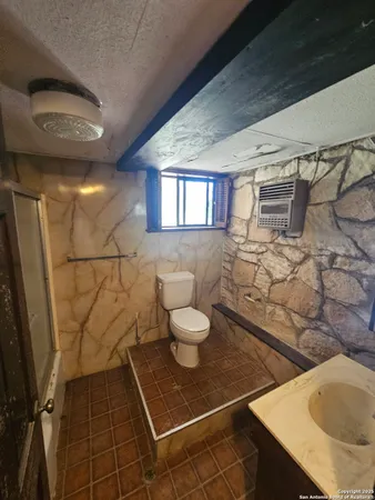 a bathroom with a sink and a shower