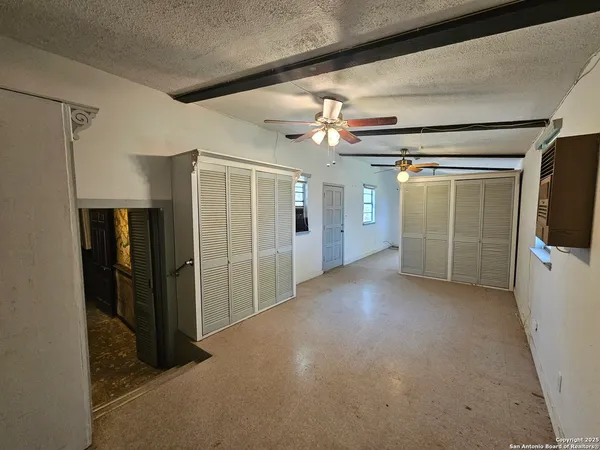 a view of a hallway with a storage space