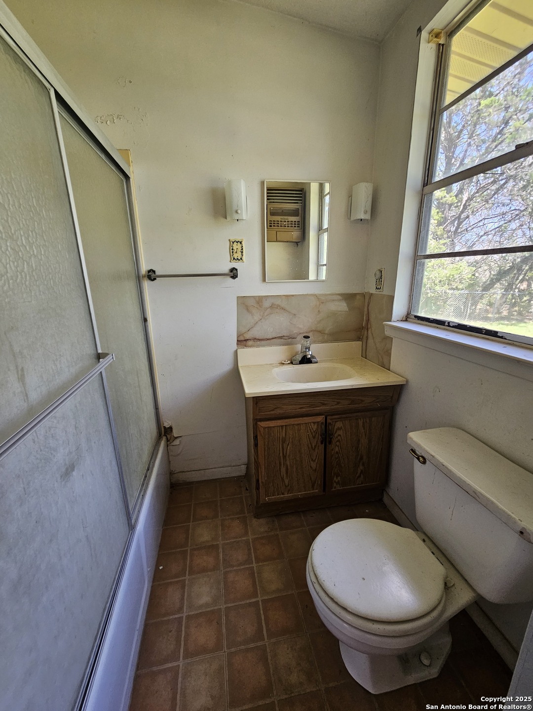29 Green Cedar Road Boerne, TX 78006 - Photo 30 of 39 a bathroom with a sink toilet and window