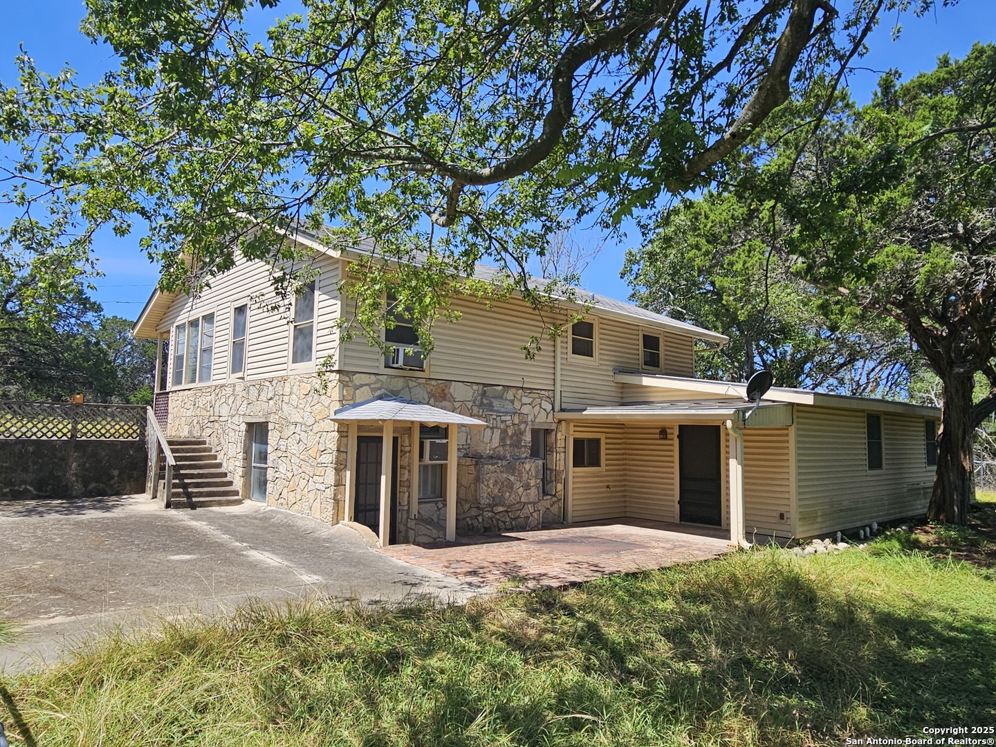 29 Green Cedar Road Boerne, TX 78006 - Photo 7 of 39 a front view of a house with a yard and garage