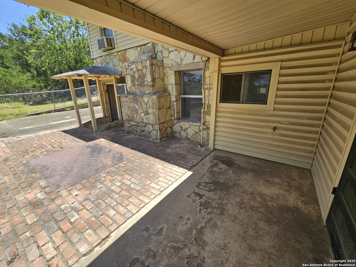 29 Green Cedar Road Boerne, TX 78006 - Photo 9 of 39 a backyard of a house with barbeque oven table and chairs
