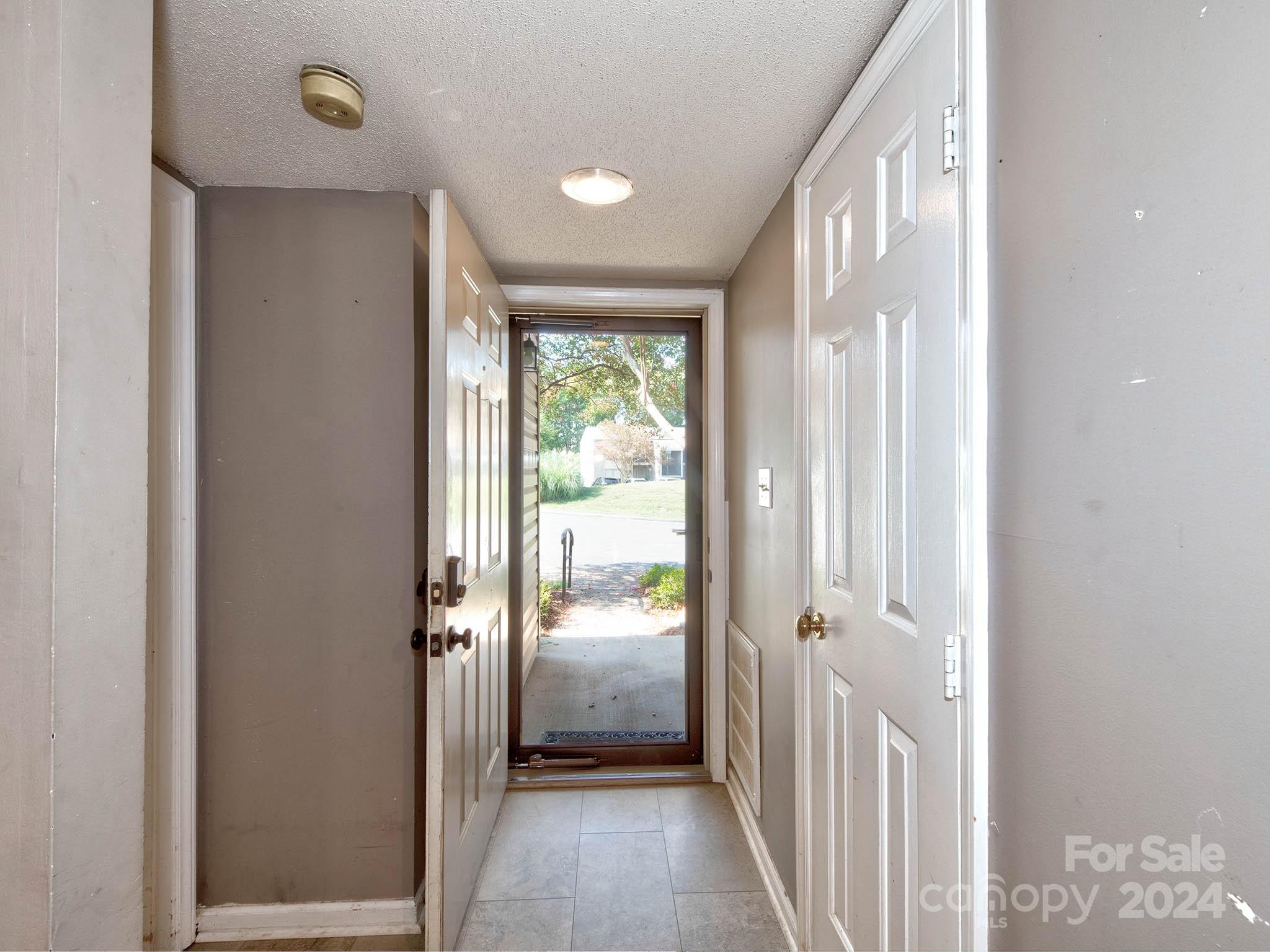 11015 Running Ridge Rd. Charlotte, NC 28226 - Photo 4 of 20 a view of a hallway with a door and stairs