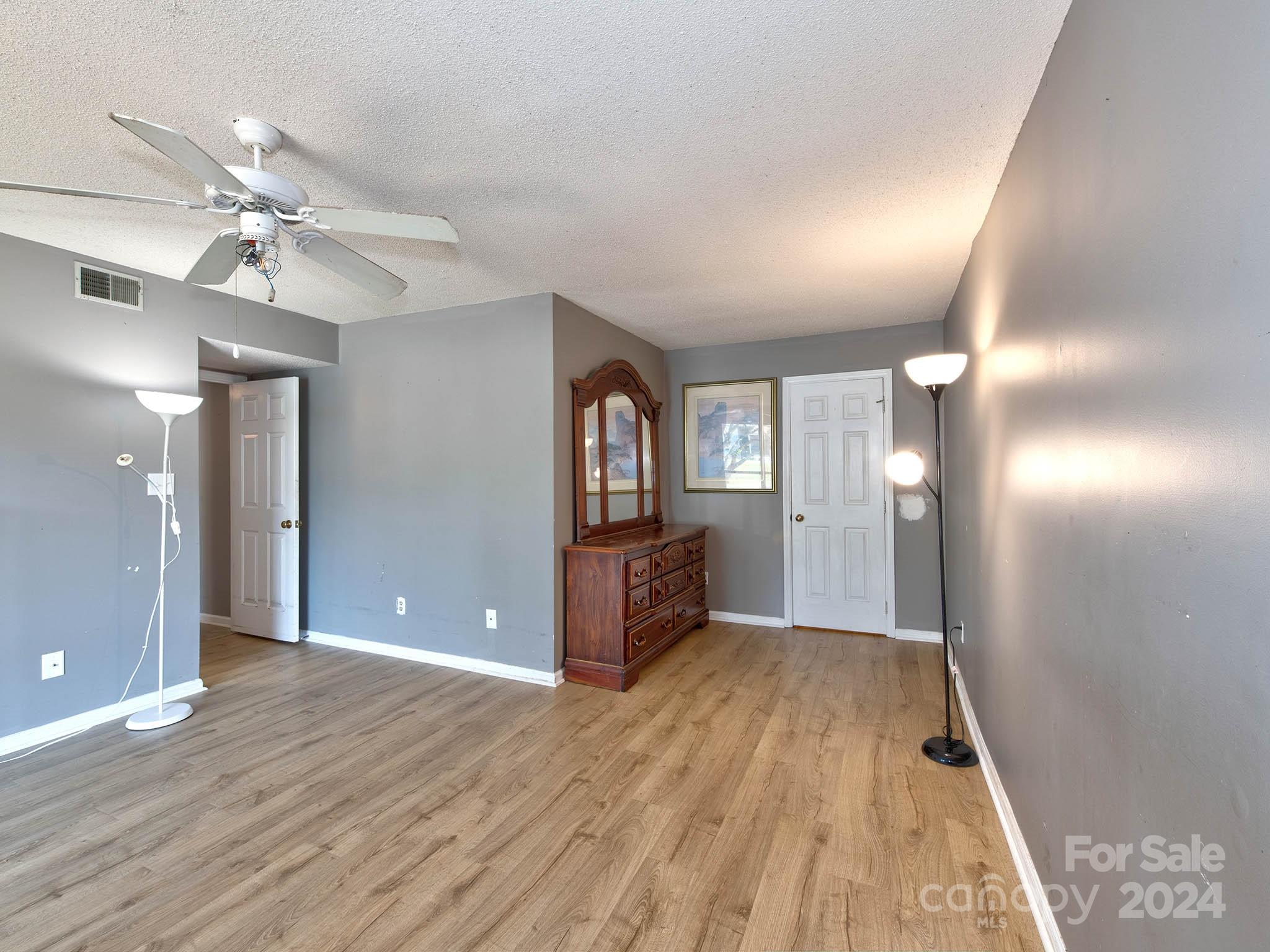 11015 Running Ridge Rd. Charlotte, NC 28226 - Photo 5 of 20 a view of a room with window and wooden floor