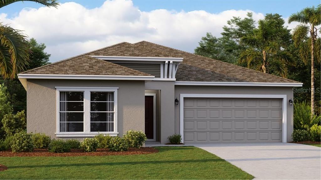 807 Reggie Road Lake Wales, FL 33859 - Photo 1 of 1 a front view of a house with a yard and garage