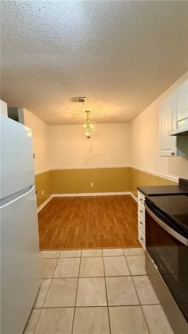 an empty room with wooden floor