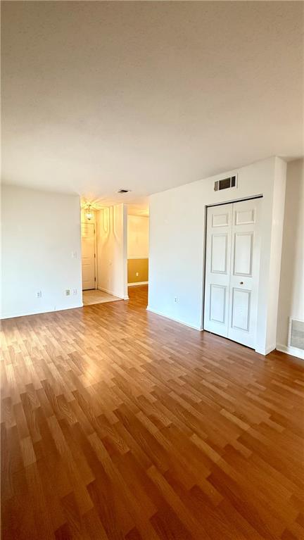 3595 Woodbriar Circle, Unit N Tucker, GA 30084 - Photo 15 of 39 an empty room with wooden floor and windows