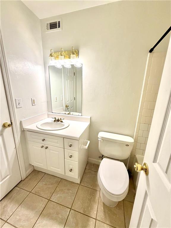 3595 Woodbriar Circle, Unit N Tucker, GA 30084 - Photo 29 of 39 a bathroom with a sink mirror vanity and toilet