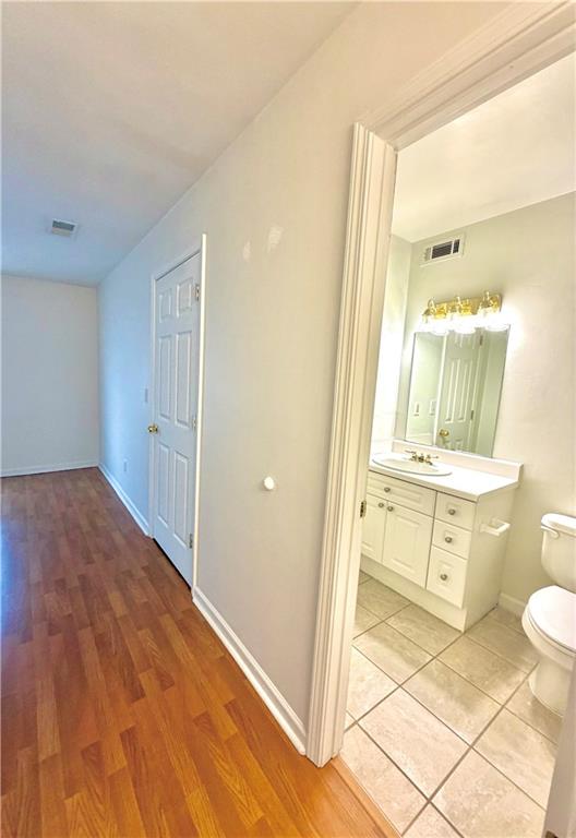 3595 Woodbriar Circle, Unit N Tucker, GA 30084 - Photo 31 of 39 a bathroom with a granite countertop sink toilet and shower